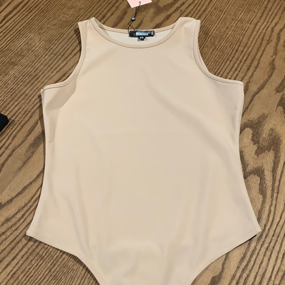 High neck, sleeveless thong, bodysuit